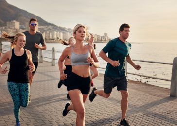 Group of young people doing running workout