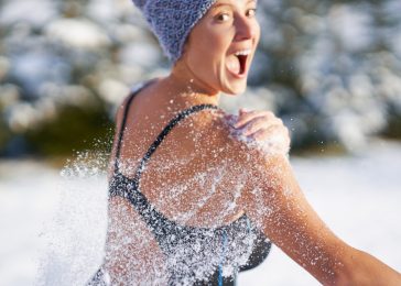 Picture of woman having fun on snow in winter